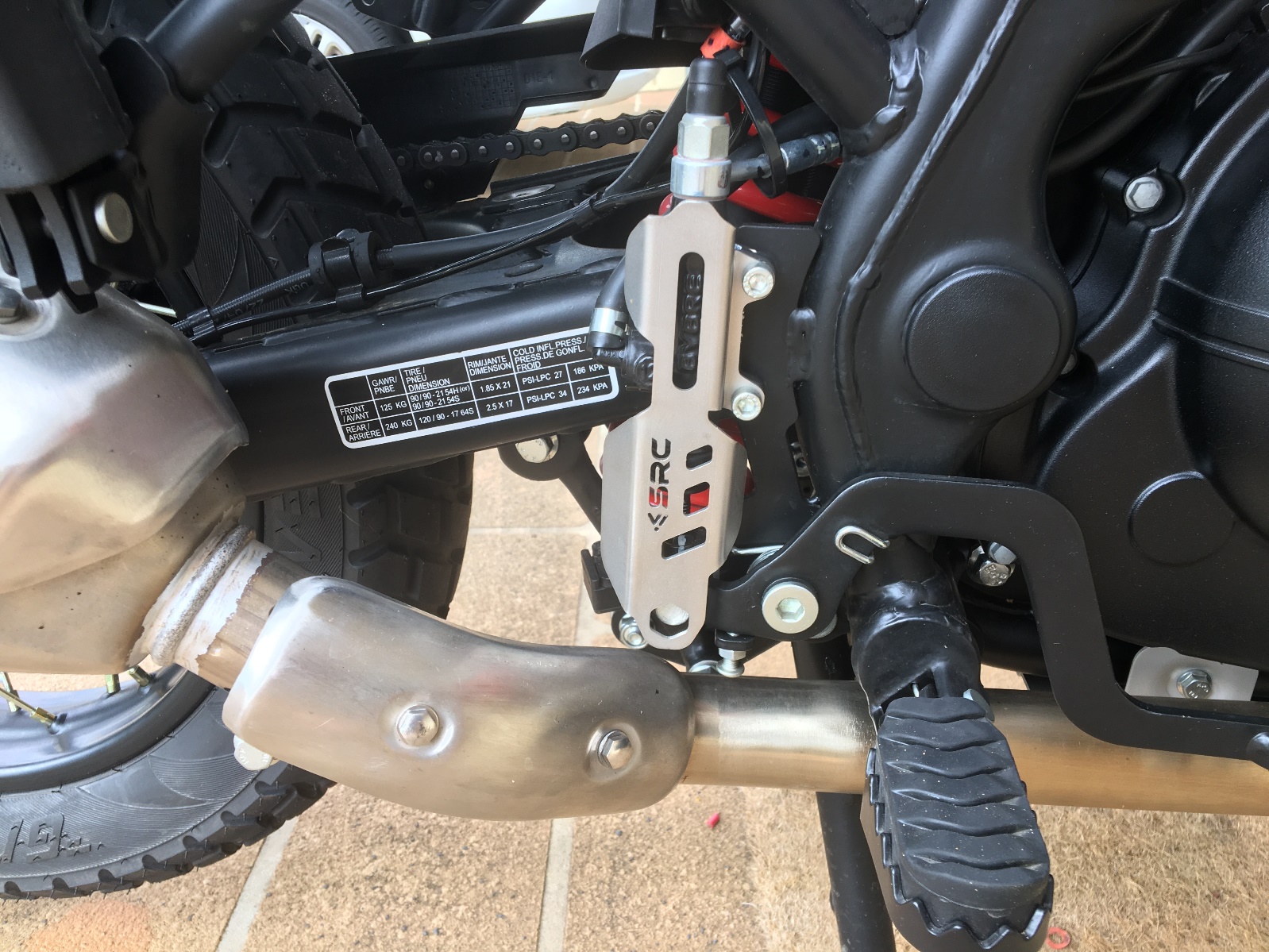 A close-up of a motorcycle engine Description automatically generated with low confidence